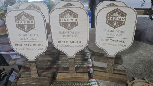 Personalized wood pickleball trophies on routed wood bases
